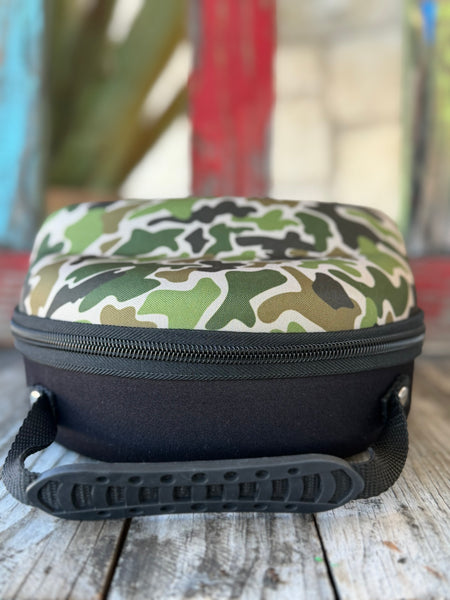 Keep your hats road-ready with the Red Dirt Company Cap Carrier. Designed in a bold green camo pattern, this durable case holds up to 4 caps and includes a built-in sunglasses compartment for easy, organized travel. Perfect for keeping your gear protected wherever the day takes you. Available at BLAIR'S Western Wear located in Marble Falls TX. 