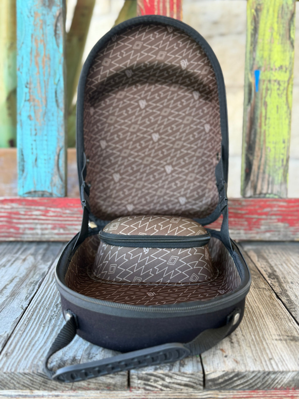 Keep your hats road-ready with the Red Dirt Company Cap Carrier. Designed in a bold green camo pattern, this durable case holds up to 4 caps and includes a built-in sunglasses compartment for easy, organized travel. Perfect for keeping your gear protected wherever the day takes you. Available at BLAIR'S Western Wear located in Marble Falls TX. 
