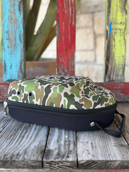 Keep your hats road-ready with the Red Dirt Company Cap Carrier. Designed in a bold green camo pattern, this durable case holds up to 4 caps and includes a built-in sunglasses compartment for easy, organized travel. Perfect for keeping your gear protected wherever the day takes you. Available at BLAIR'S Western Wear located in Marble Falls TX. 
