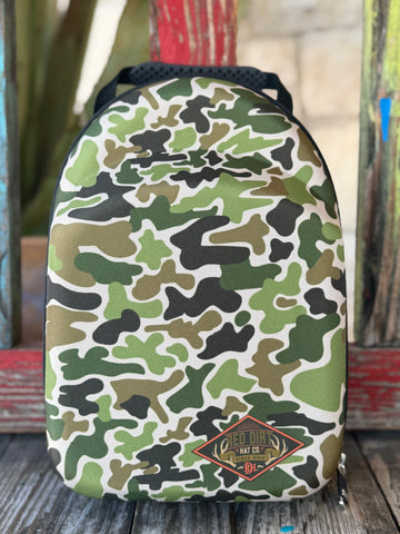 Keep your hats road-ready with the Red Dirt Company Cap Carrier. Designed in a bold green camo pattern, this durable case holds up to 4 caps and includes a built-in sunglasses compartment for easy, organized travel. Perfect for keeping your gear protected wherever the day takes you. Available at BLAIR'S Western Wear located in Marble Falls TX. 