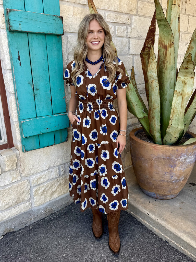Women's brown and blue retro floral short sleeve midi dress with V-neckline, elasticized waist, tiered skirt, and pockets — Blair's Western Wear Marble Falls TX