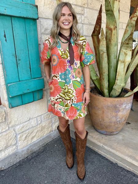 Side view of women's coral and teal retro floral shift mini dress with relaxed silhouette — Blair's Western Wear Marble Falls TX