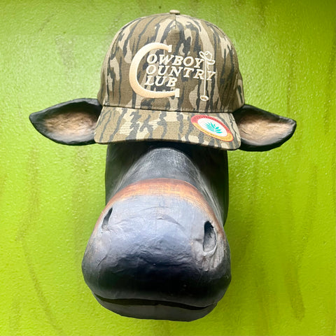 Sendero cap in olive camo, features breathable mesh back, with embroidered Cowboy Country Club logo on front - COWBOY CC. Available at Blair's Western Wear, Marble Falls, TX.