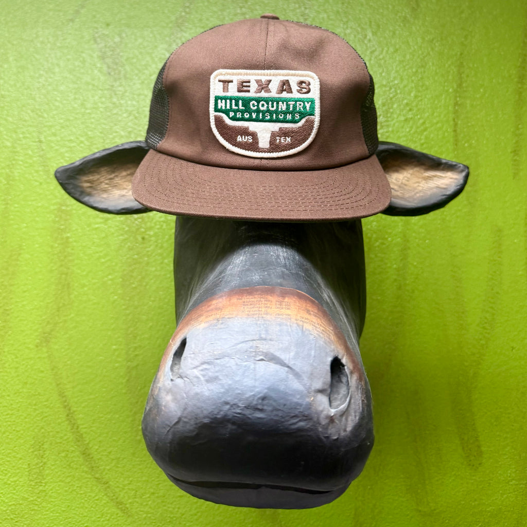 THC Provisions Trucker Hat in Brown, features a Texas Hill Country Provisions patch, with breathable mesh back panels and adjustable snapback fit. Available at Blair's Western Wear, Marble Falls, TX.
