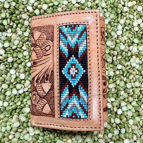 Tackrus Challenger Trifold Tan Leather Wallet with Aztec Beaded Inlay, crafted from genuine leather with floral tooling, and designed with multiple card slots and an ID window - 18RSW46T. Available at Blair's Western Wear, Marble Falls, TX.