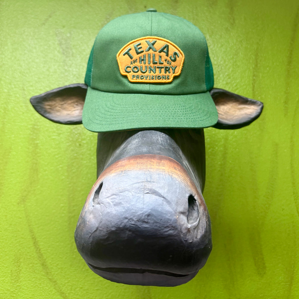 Texas Hill Country Provisions Trucker Hat in Green/Gold, features breathable mesh back panels, with an adjustable snapback closure - HILLTOP GRN. Available at Blair's Western Wear, Marble Falls, TX.