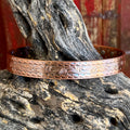 Western copper cuff bracelet in engraved scroll design, crafted from solid copper that develops natural patina over time, with detailed western scroll engraving and geometric stamped border - BC6431. Available at Blair's Western Wear, Marble Falls, TX.