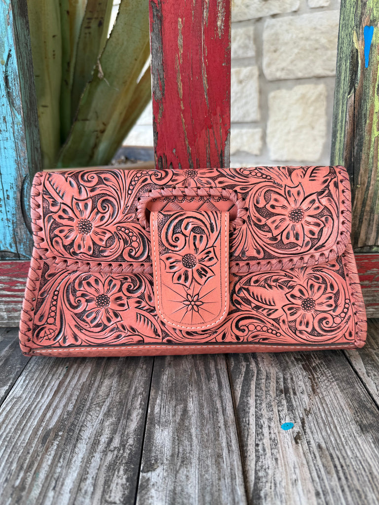 Women’s American Darling clutch tool flap strap wallet in coral, hand-tooled genuine leather exterior, with secure snap-flap closure – ADBG1134J. Available at Blair's Western Wear, Marble Falls, TX.