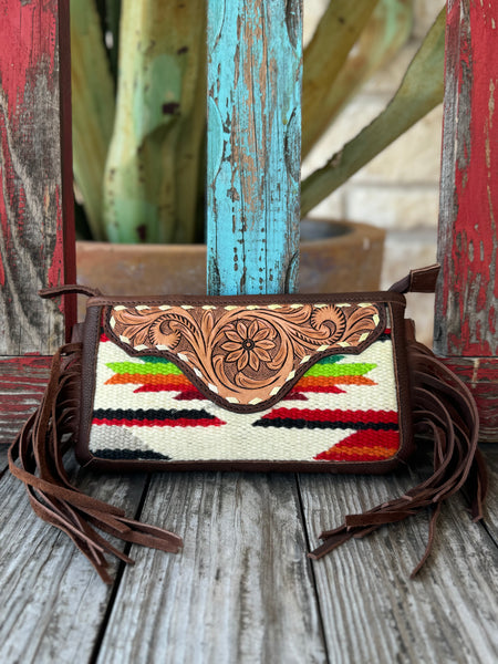 Women’s American Darling Crossbody Serape Fringe Purse in brown leather with red, green, and cream serape pattern, featuring a hand-tooled floral flap and side fringe – ADBGA188P. Available at Blair’s Western Wear, Marble Falls, TX.