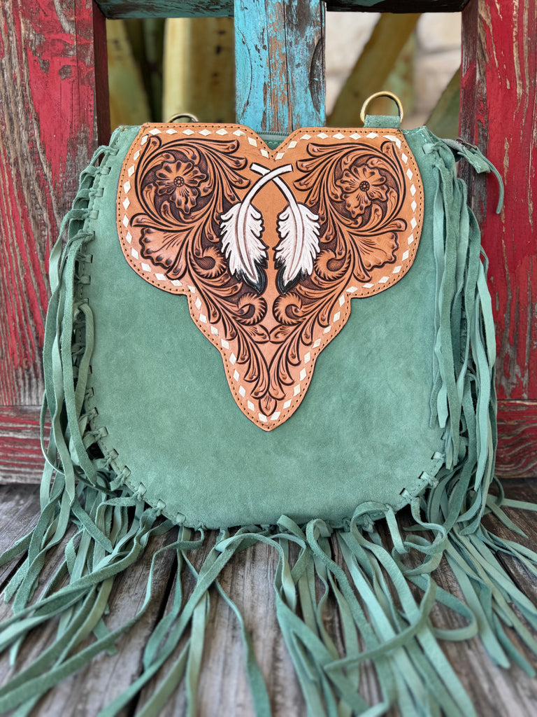 Women’s American Darling fringe whip feather purse in sage leather, featuring a hand-tooled floral and feather flap, with fringe trim and zippered storage – ADBGA431D. Available at Blair’s Western Wear, Marble Falls, TX.