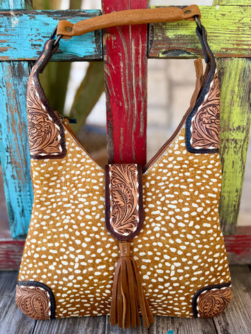 Women’s American Darling handbag small tool edge handbag in tan, crafted with genuine hair-on hide for a one-of-a-kind look, with hand-tooled leather trim that reinforces high-wear areas - ADBGA237D. Available at Blair's Western Wear, Marble Falls, TX.