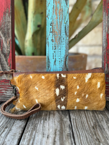 Women’s American Darling wristlet in hair-on deer hide with smooth leather back, secure zip-top closure, and detachable wrist strap – ADBG344CZ. Available at Blair’s Western Wear, Marble Falls, TX.