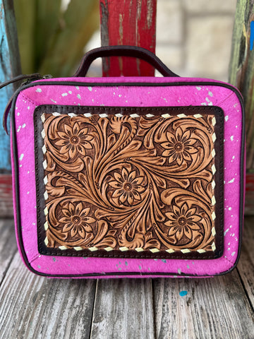 Women’s American Darling makeup case tool hide in hot pink and tan, genuine hair-on hide with hand-tooled floral leather panel, with secure zip-around closure and structured top handle - ADBGA233. Available at Blair's Western Wear, Marble Falls, TX.