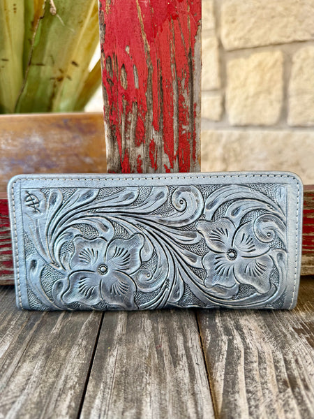Women’s American Darling wallet silver tooled snap wallet in metallic silver, hand-tooled genuine leather exterior with raised floral scrollwork, with multiple interior card slots for organized storage - ADBG1269E. Available at Blair's Western Wear, Marble Falls, TX.