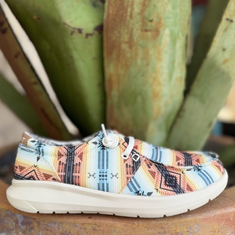 Women's Ariat Cruiser Casual Slip-On Shoes in a Sunset color combo with a serape pattern, featuring a lightweight EVA midsole for shock absorption with a clear Duratread™ outsole for durability – 10061339. Available at Blair's Western Wear, Marble Falls, TX