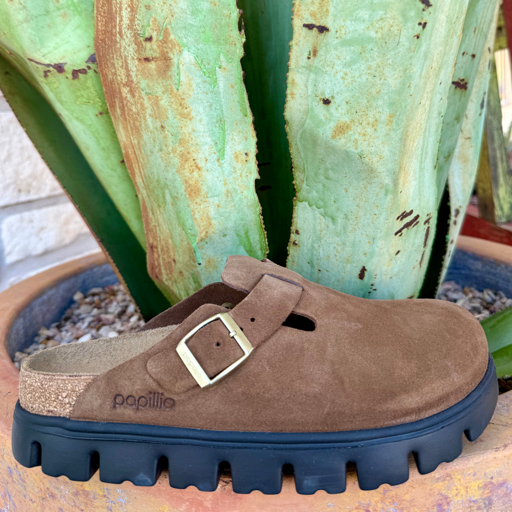 Women’s Birkenstock Boston Chunky suede clog in Dark Tea, crafted from soft suede leather for lasting comfort, with an adjustable metal buckle and contoured cork-latex footbed – 1028402. Available at Blair’s Western Wear, Marble Falls, TX.