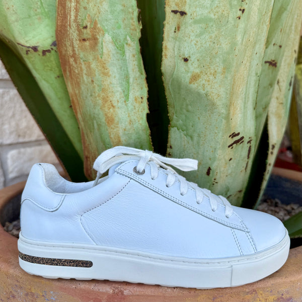 Women’s Birkenstock Sneaker Tennis Shoe in White, crafted from natural leather that molds to your foot, with a cushioned cork-latex footbed for arch support – 1017724. Available at Blair's Western Wear, Marble Falls, TX.