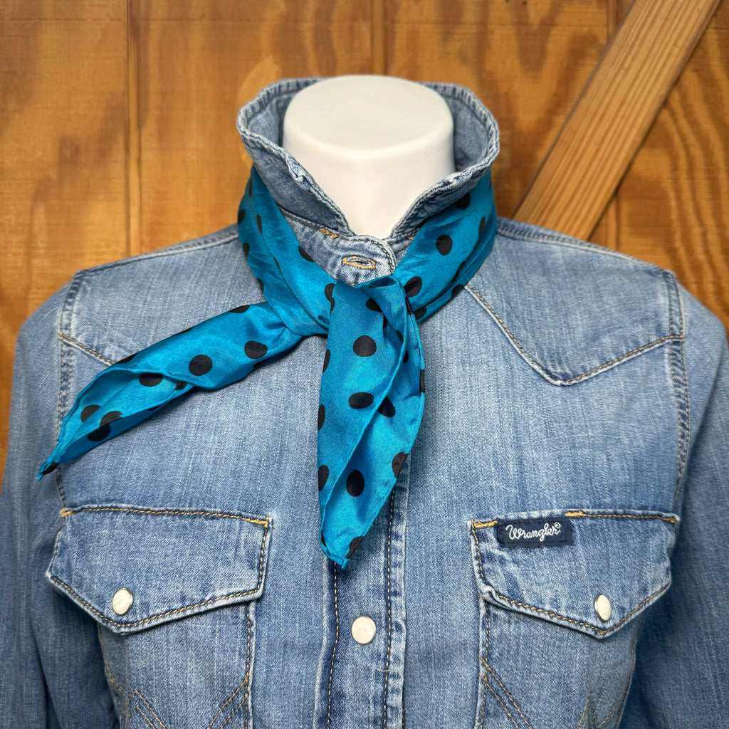 Bold color, effortless style. This blue and black polka dot wildrag is the kind of accessory that works as hard as you do — keeping you warm on a cool morning ride and turning heads at the arena all afternoon.