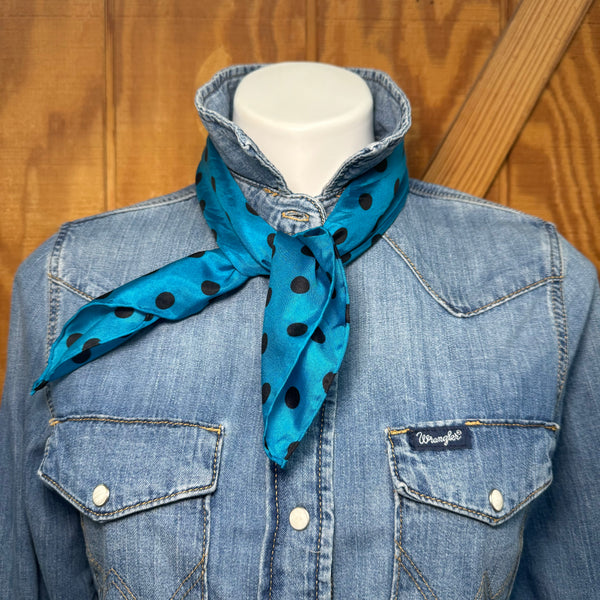 Bold color, effortless style. This blue and black polka dot wildrag is the kind of accessory that works as hard as you do — keeping you warm on a cool morning ride and turning heads at the arena all afternoon.