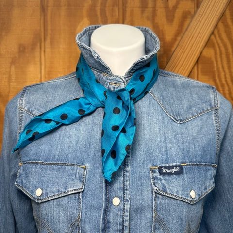 Bold color, effortless style. This blue and black polka dot wildrag is the kind of accessory that works as hard as you do — keeping you warm on a cool morning ride and turning heads at the arena all afternoon.