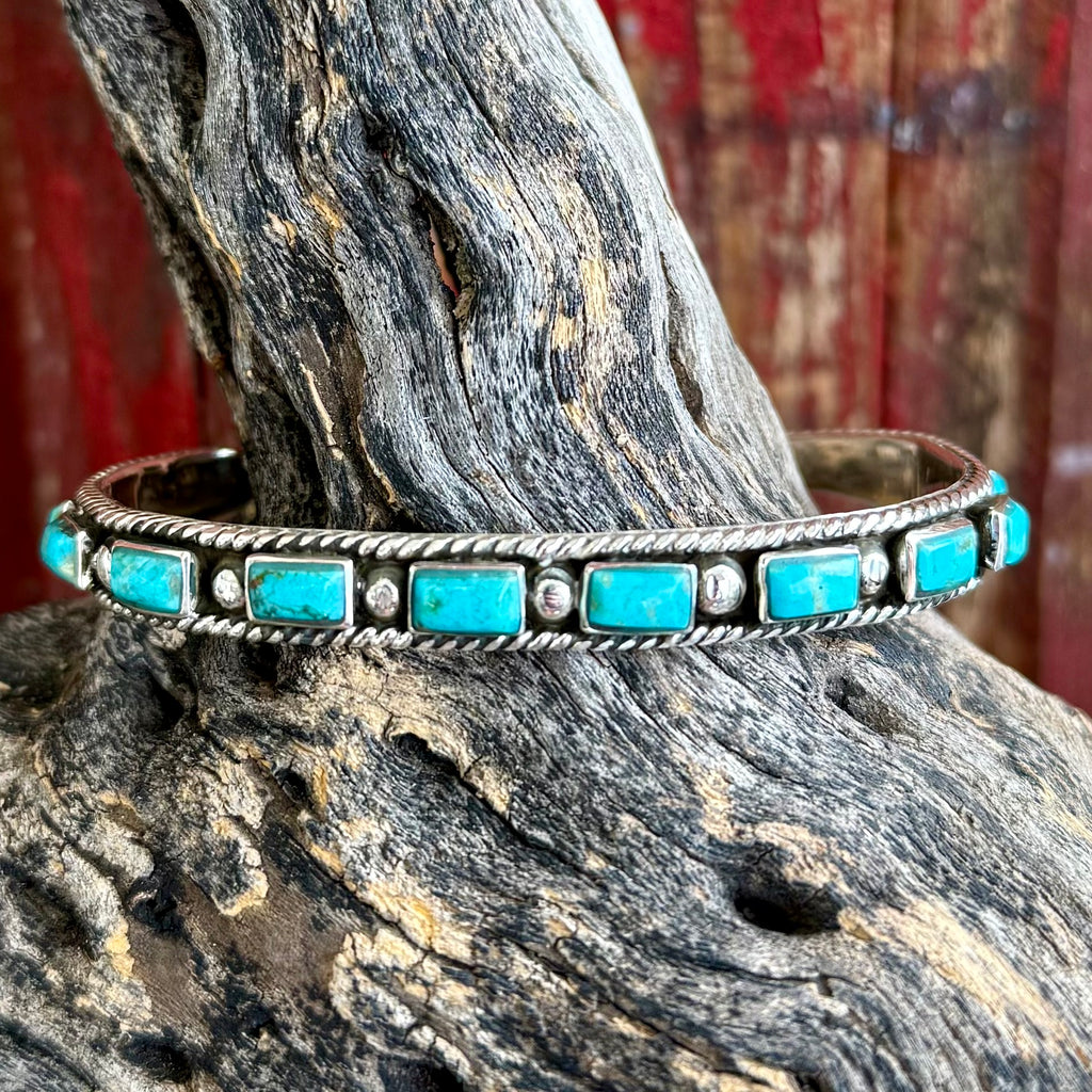 Women’s Boho Sol cuff bracelet with turquoise rectangle stones in silver-tone rope detailing, featuring an adjustable open-cuff fit, with a lightweight design for comfortable wear - T4155. Available at Blair's Western Wear, Marble Falls, TX.