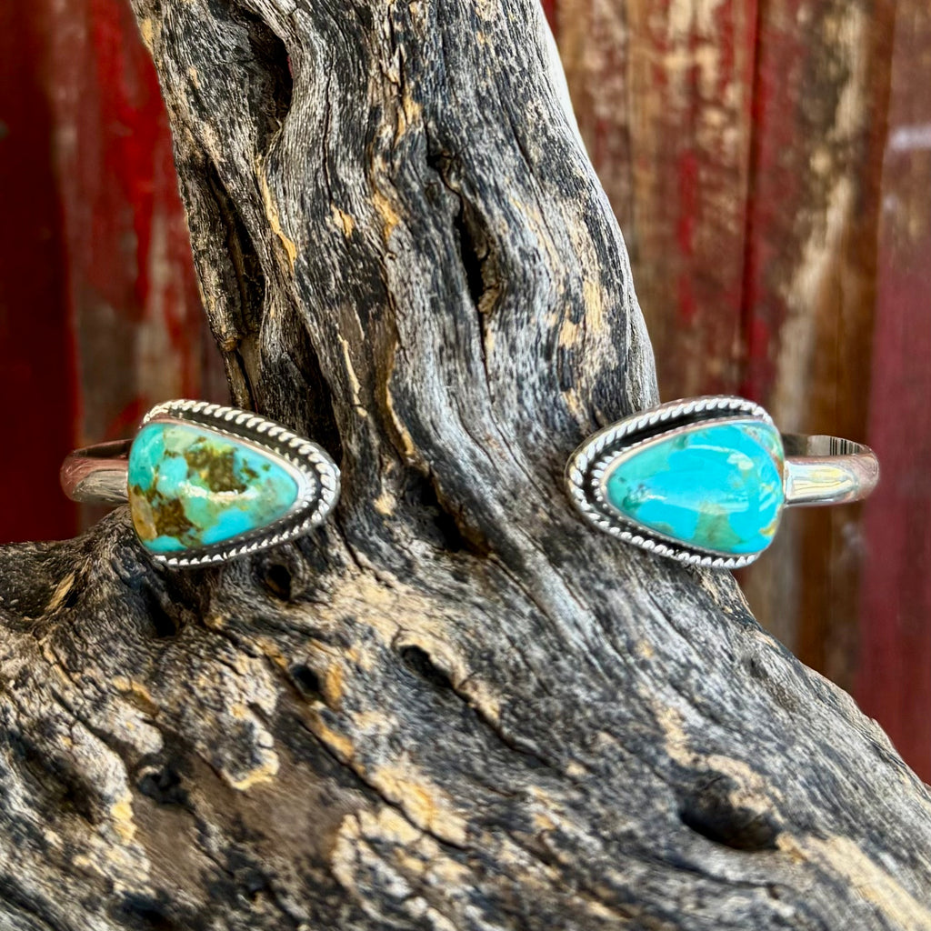 Women’s Boho Sol cuff bracelet with turquoise triangle stones in silver, featuring genuine turquoise variation, with an adjustable open-cuff fit – T4106X. Available at Blair's Western Wear, Marble Falls, TX.