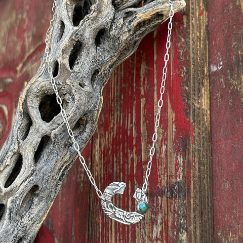 Women’s Boho Sol Necklace in Turquoise/Silver, hand-tooled crescent pendant with floral detailing, with a vibrant turquoise stone inset for a pop of color - T379XSC. Available at Blair's Western Wear, Marble Falls, TX.
