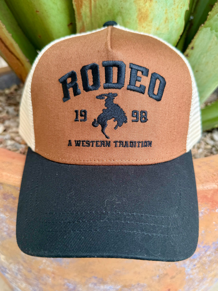 Women’s Cinch Rodeo Mesh Cap in chocolate and black, embroidered rodeo graphic with bold lettering, breathable mesh back with adjustable snapback closure - CCC0041039. Available at Blair's Western Wear, Marble Falls, TX.