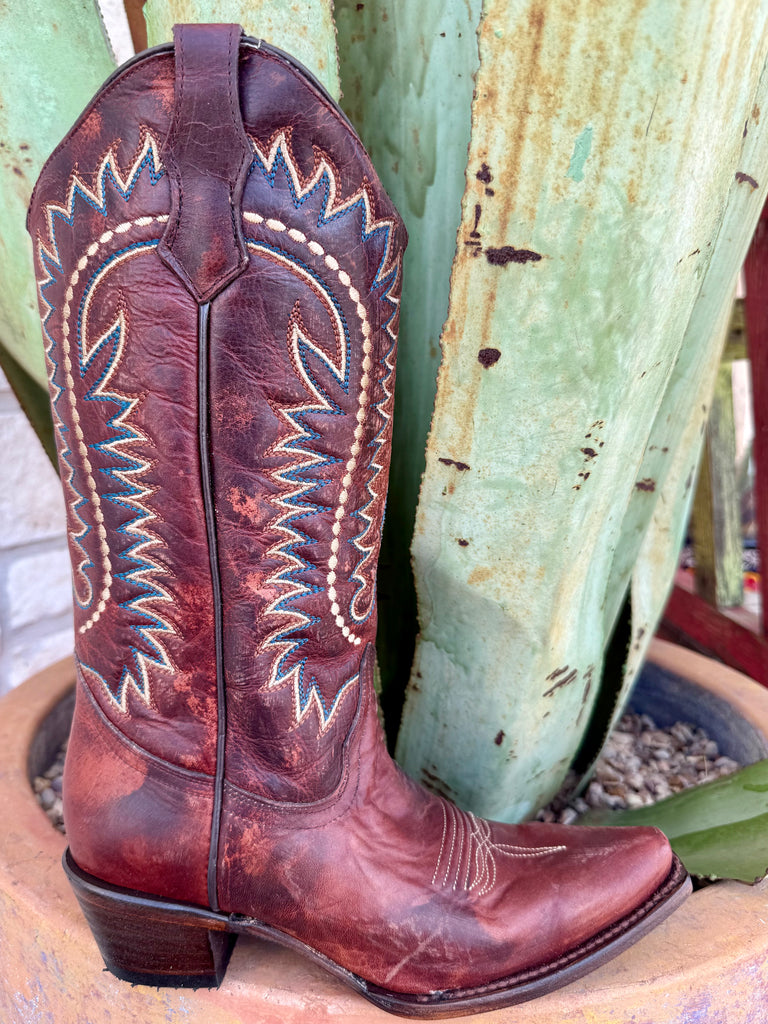 Women’s Circle G Western T-toe boot in distressed brown leather, featuring blue and cream embroidery, with a stacked heel for stable everyday wear – L8000. Available at Blair’s Western Wear, Marble Falls, TX.
