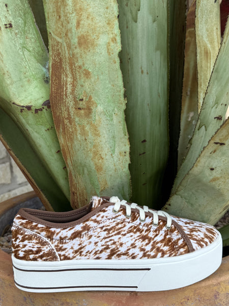 Women's brown and white cowhide print platform sneaker with chunky white sole and lace-up closure — Blair's Western Wear Marble Falls TX