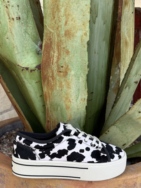 Women's black and white cowhide print platform sneaker with chunky white sole and lace-up closure — Blair's Western Wear Marble Falls TX