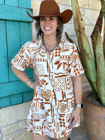 Women’s ivory and rust printed button front shirt dress with lightweight fabric and relaxed fit - G7283UBQ. Available at Blair's Western Wear, Marble Falls, TX.