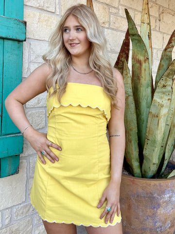 Women’s yellow strapless mini dress with scalloped trim and tailored fit - A4121. Available at Blair's Western Wear, Marble Falls, TX.