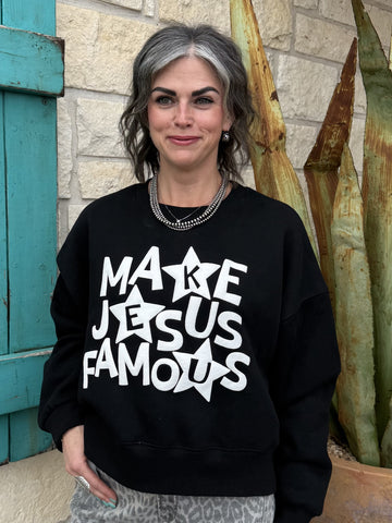 Women’s black graphic sweatshirt pullover with “Make Jesus Famous” design, relaxed fit with soft fleece interior - make famous. Available at Blair's Western Wear, Marble Falls, TX.