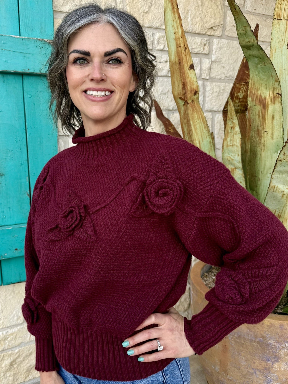 Women’s knit sweater pullover in burgundy, textured fabric with 3D floral appliqué and ribbed mock neck - CTS1088. Available at Blair's Western Wear, Marble Falls, TX.