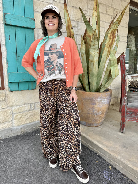 Women’s leopard print wide leg pants in brown and black, elastic drawstring waist with star stripe side detail - VP72573. Available at Blair's Western Wear, Marble Falls, TX