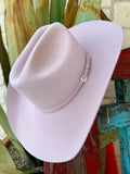 Light pink felt cowgirl hat with a creased cattleman crown, curved brim and matching felt band with silver-tone buckle trim — Blair's Western Wear Marble Falls TX