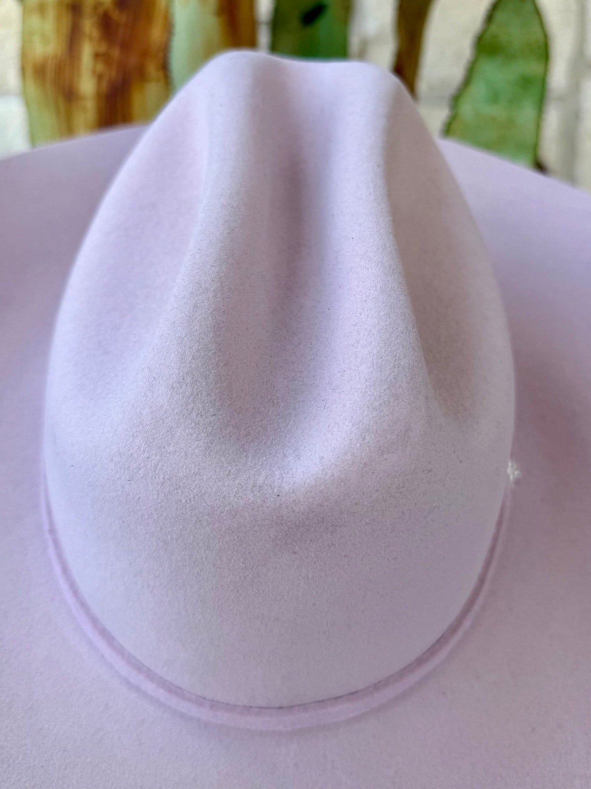 Light pink felt cowgirl hat with a deep cattleman crown crease, sculpted side dents and softly textured felt — Blair's Western Wear Marble Falls TX