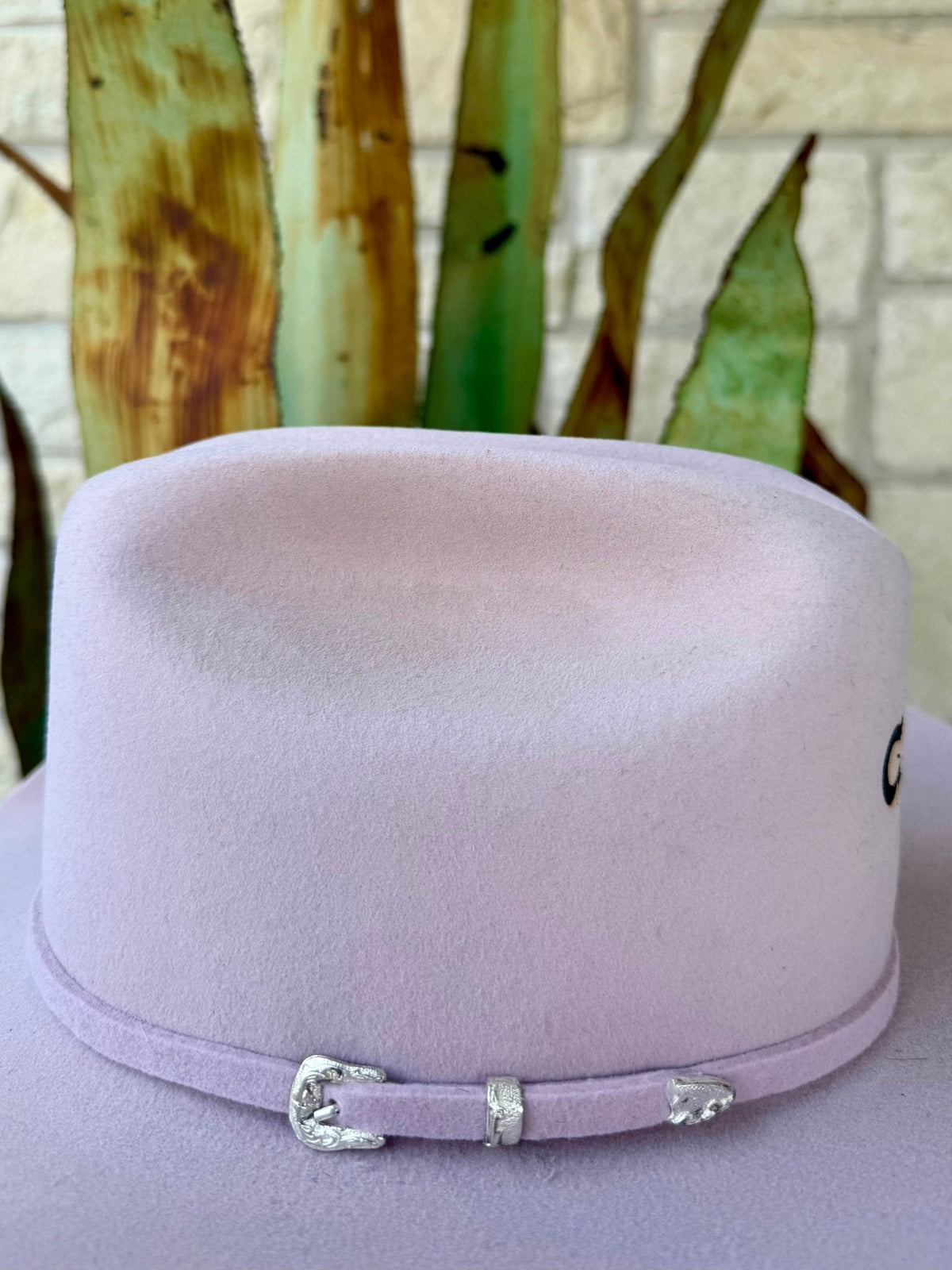 Light pink felt cowgirl hat with a matching band and decorative silver-tone buckle, keeper and pointed metal tip — Blair's Western Wear Marble Falls TX