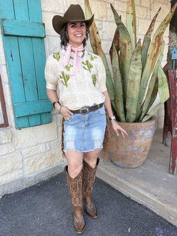 Women’s light wash distressed denim mini skirt with frayed hem and classic pocket design - DSK074-CAW. Available at Blair's Western Wear, Marble Falls, TX.
