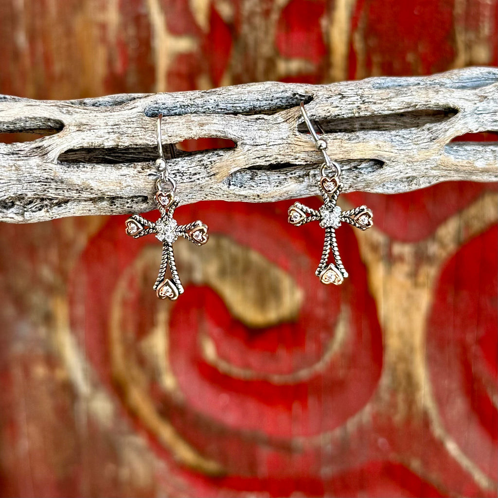 Women’s Montana Silversmiths cross dangle earrings with heart accents in silver and rose gold, faith-inspired cross design with crystal center, lightweight dangle style for comfortable wear – ER6040. Available at Blair's Western Wear, Marble Falls, TX.