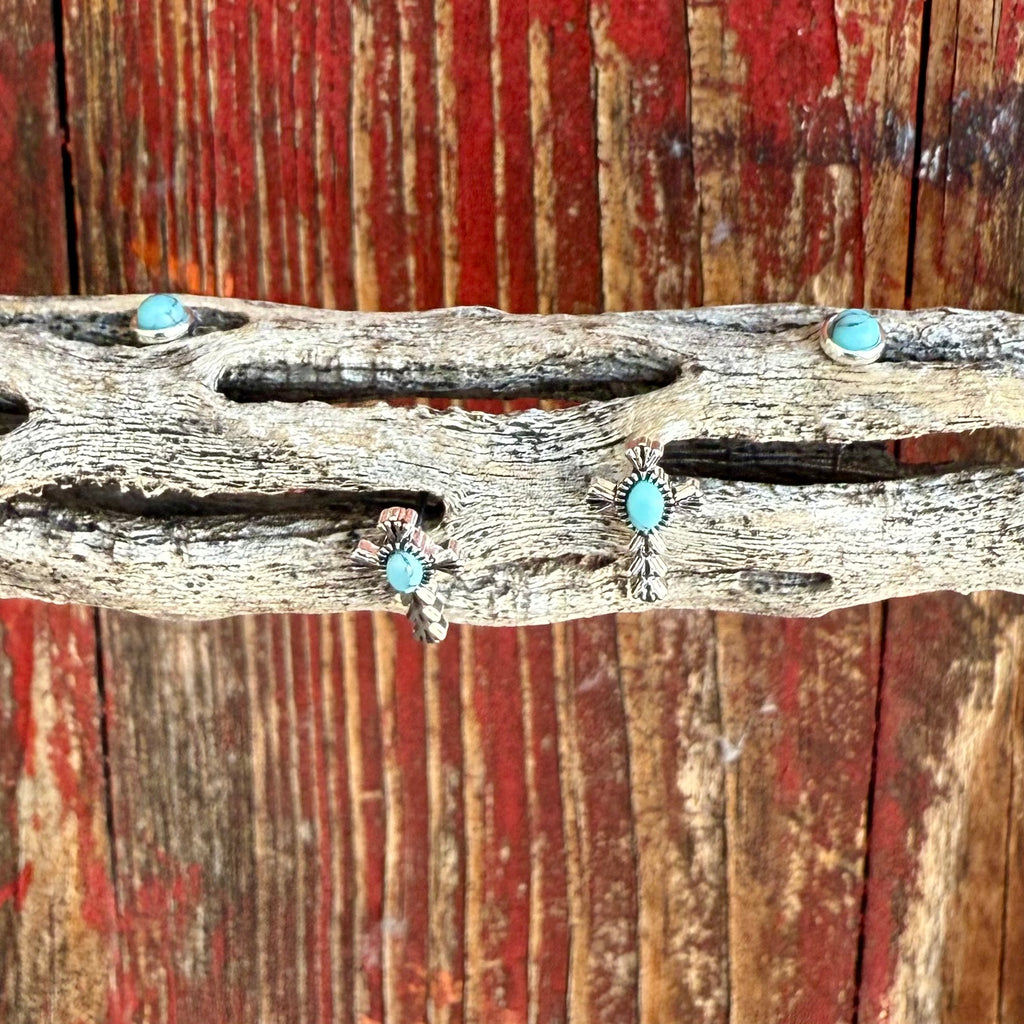 Women’s Montana Silversmiths Cross Turquoise Post Earrings in silver and turquoise, featuring a dual-post design with a simple turquoise stud and a cross-accented turquoise stone, tarnish-resistant finish, and stainless steel posts - ER6319. Available at Blair's Western Wear, Marble Falls, TX.