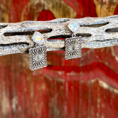 Women’s Montana Silversmiths silver post canyon earrings in silver, square cubic zirconia post for subtle sparkle, with engraved Western scroll drop for classic style – ER6451. Available at Blair's Western Wear, Marble Falls, TX.