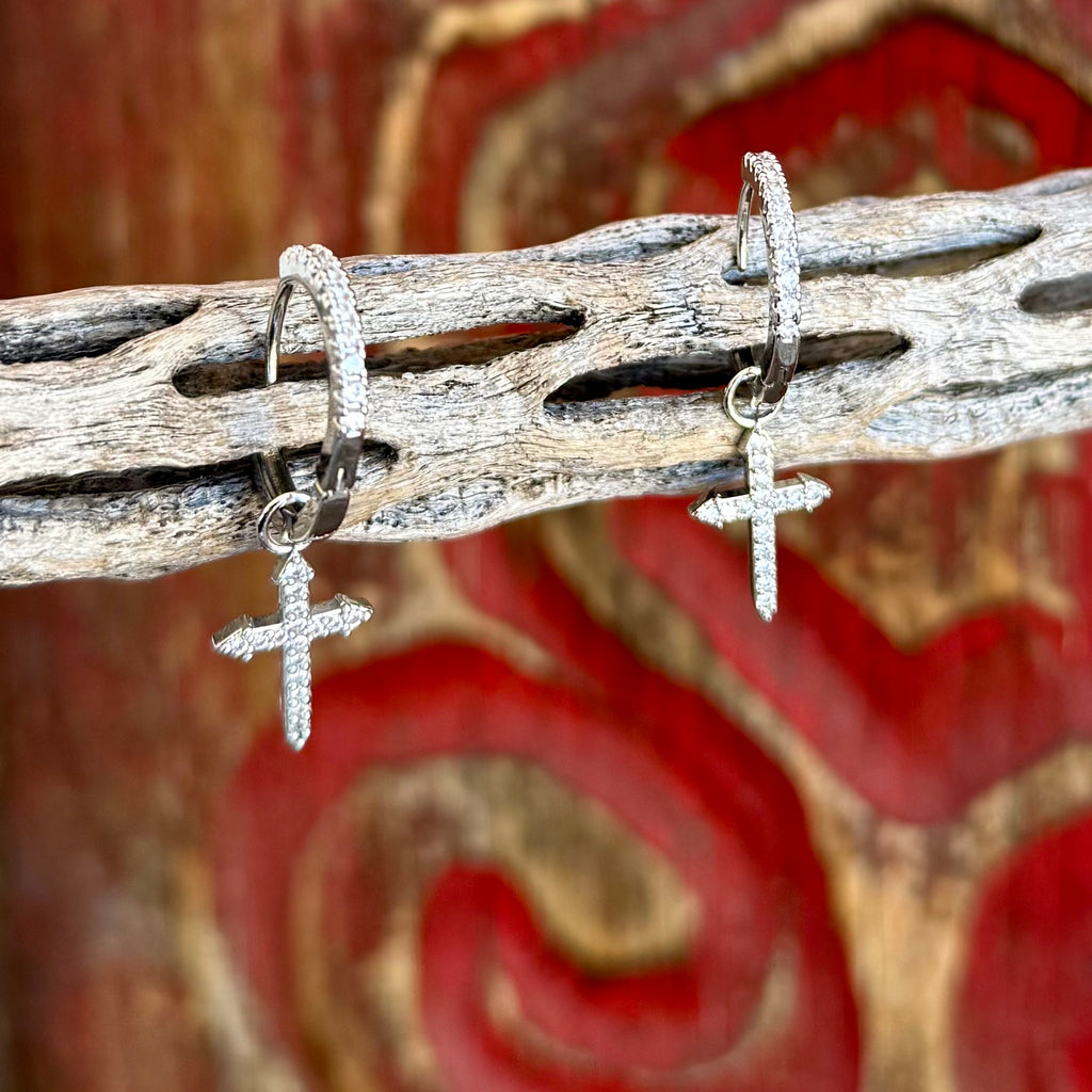 Women’s Montana Silversmiths earrings silver cross devotion hoop earrings in silver, lightweight pavé-accented hoops, with dangling cubic zirconia cross charms for comfortable everyday wear - ER5642. Available at Blair's Western Wear, Marble Falls, TX.
