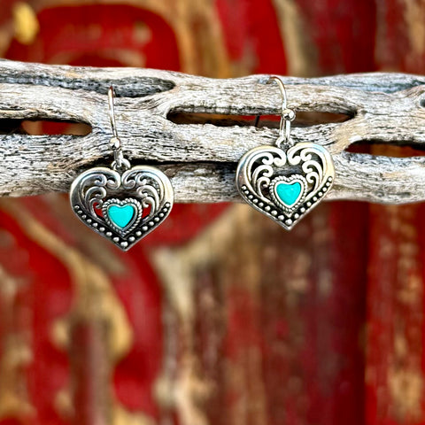 Women’s Montana Silversmiths earrings heart fierce heart in silver, sculpted heart design with raised scroll detailing, with turquoise-colored heart accent - ER6103. Available at Blair's Western Wear, Marble Falls, TX.
