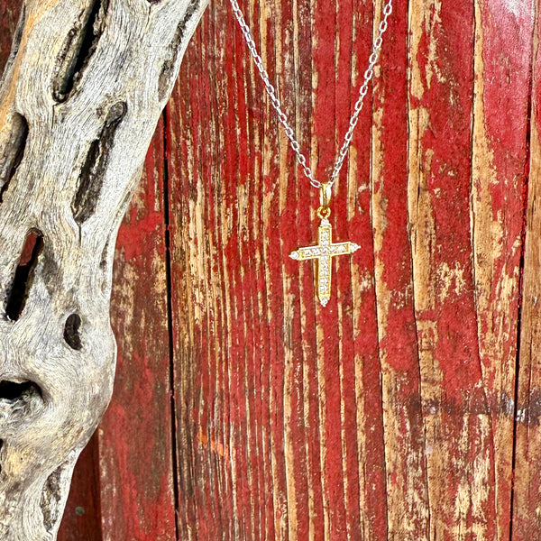 Women’s Montana Silversmiths necklace Dorado Cross in gold, crafted with clear cubic zirconia for lasting brilliance, with tarnish-resistant Montana Armor finish – NC6318. Available at Blair’s Western Wear, Marble Falls, TX.