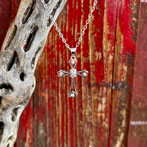 Women’s Montana Silversmiths necklace silver and rose gold cross pendant in silver, centered with brilliant clear stones that catch the light, with detailed rope-texture edging for added Western character - NC6040. Available at Blair's Western Wear, Marble Falls, TX.