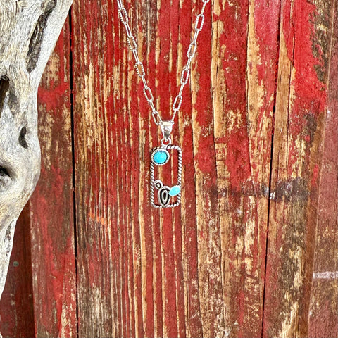 Women’s Montana Silversmiths Necklace Desert Mirage in silver-tone with turquoise stones, featuring a cactus accent and rope-edged rectangular pendant on a 20-inch chain – NC6327. Available at Blair's Western Wear, Marble Falls, TX.