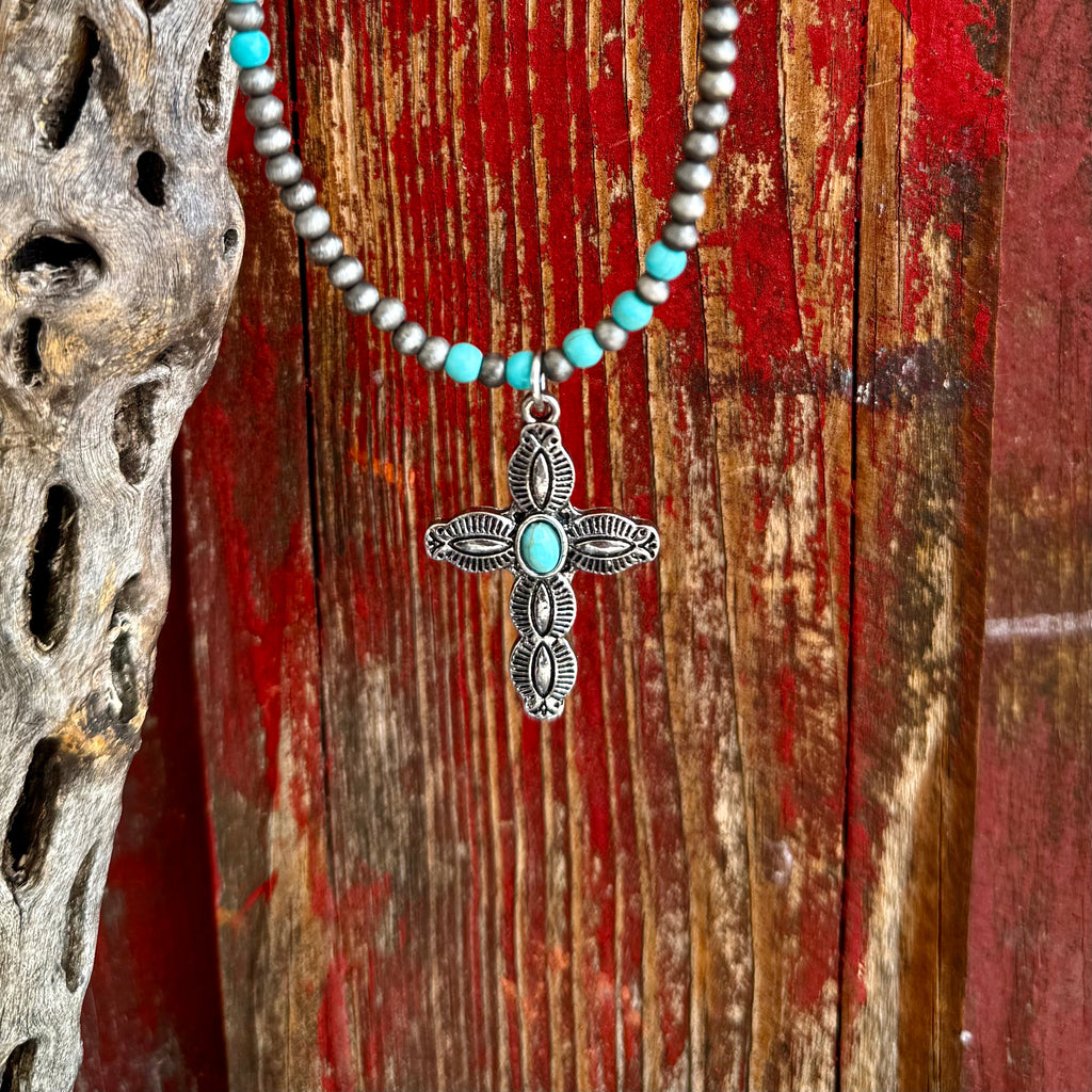 Women’s Montana Silversmiths necklace stone cross in silver and turquoise, engraved cross pendant with turquoise center stone, with silver and turquoise beaded necklace – ANC5420. Available at Blair's Western Wear, Marble Falls, TX.