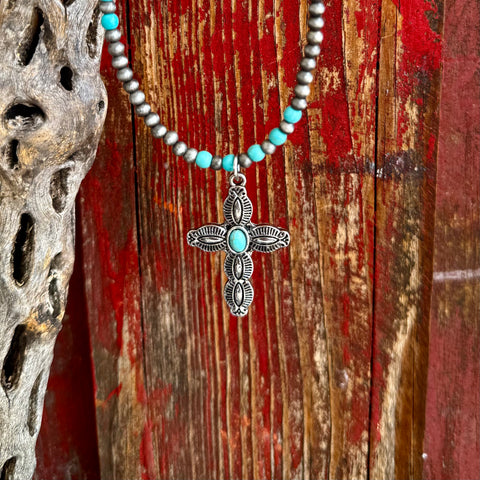 Women’s Montana Silversmiths necklace stone cross in silver and turquoise, engraved cross pendant with turquoise center stone, with silver and turquoise beaded necklace – ANC5420. Available at Blair's Western Wear, Marble Falls, TX.